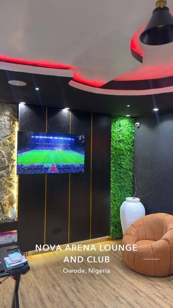 Nova Arena lounge with plant wall and armchair