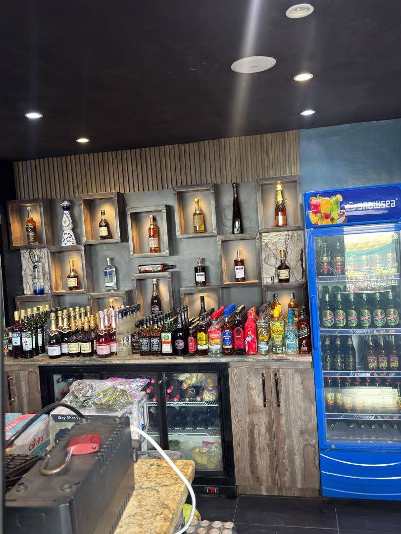 Nova Arena main bar bottle selection and drinks fridge
